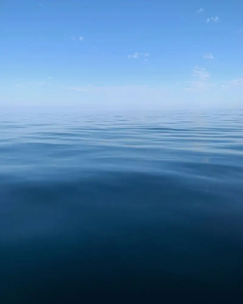 Calm blue sea under a clear sky